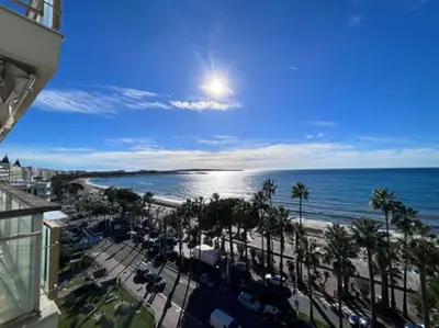 a view of the beach and the ocean from a building at Cannes appart 3 chambres luxe - Impératrice in Cannes