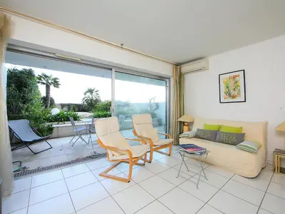 a living room with a couch and chairs at Apartment Cannes Bay-2 by Interhome in Cannes