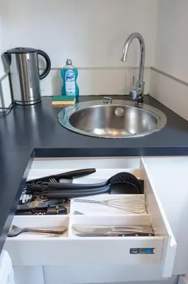 a drawer in a kitchen with a sink at Le Joffre - Hypercentre - 200m Palais - AC in Cannes