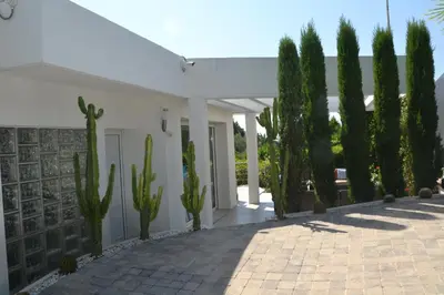 a white house with a bunch of cactus at CANNES VILLA: 15 mins walk to beach & centre in Cannes
