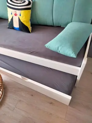 a bunk bed with a couch and a pillow at Bella Vista - Piscine, vue mer, parking, clim in Cannes