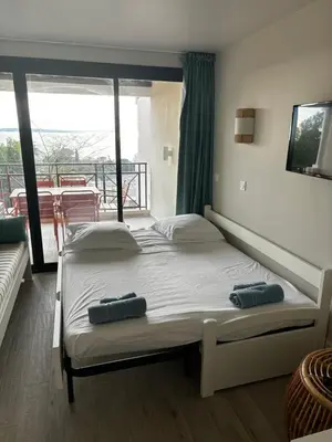 a bedroom with a bed with two pillows on it at Villa Francia Cannes in Cannes