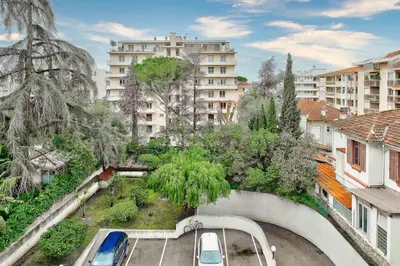 arial view of a city with cars parked in a parking lot at Superbe studio avec terrasse à 10 min de la plage in Cannes