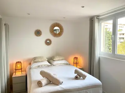 a bedroom with a bed with two stuffed animals on it at Studio hyper centre Cannes - Tout à pied in Cannes