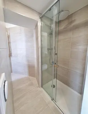a shower with a glass door in a bathroom at Studio hyper centre Cannes - Tout à pied in Cannes