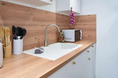 a kitchen counter with a sink and a microwave at Le Val By ApiRent #Duplex #Climatisation in Le Cannet