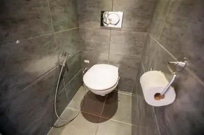 a bathroom with a toilet and a shower at Comfort 6 People Apartment by Connexion in Cannes