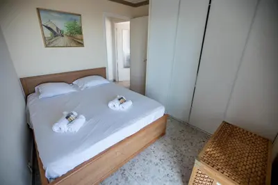 a bedroom with a bed with two towels on it at Very Nice View by Connexion in Cannes