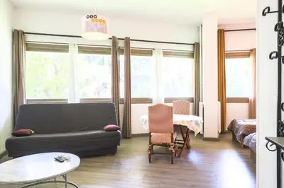 a living room with a couch and a table at ACCI Cannes Gallia in Cannes