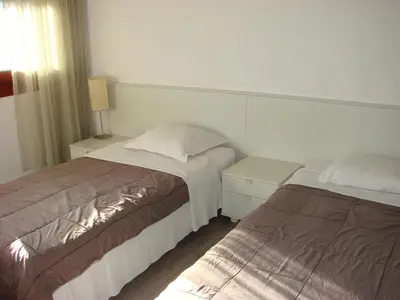 a bedroom with two beds next to each other at ACCI Cannes Gallia in Cannes
