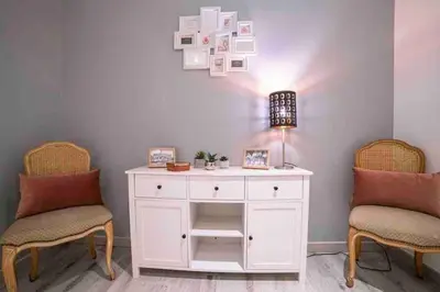 a white desk with two chairs and a lamp at MARIE ANTOINETTE in Cannes