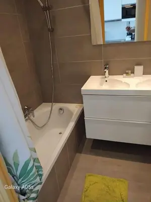 a bathroom with a sink and a tub and a shower at Studio Le Trident de la mer - Axelle Loc'Appart in Cannes