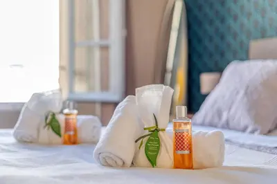 a hotel room with towels on a bed at L’app’Art Cannes - Contemporain Centre-Ville in Cannes