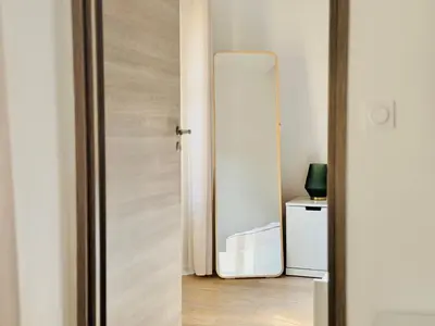 an open door to a room with a refrigerator at Le Bohème - Logement Cozy centre in Cannes
