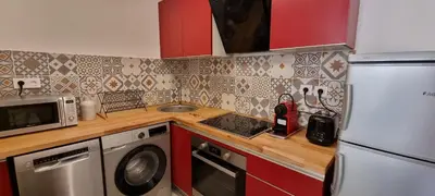 a kitchen with a refrigerator and a sink and a dishwasher at Vieux Port One Bedroom Apartment B22 in Cannes