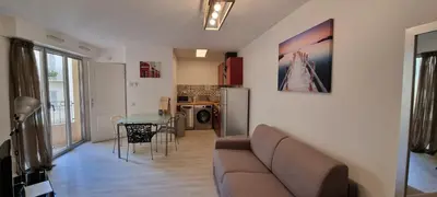 a bedroom with a large white bed with a mirror at Vieux Port One Bedroom Apartment B22 in Cannes