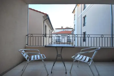 a living room with a couch and a television at Vieux Port One Bedroom Apartment B22 in Cannes