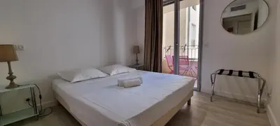 a living room with a couch and a table at Vieux Port One Bedroom Apartment B22 in Cannes