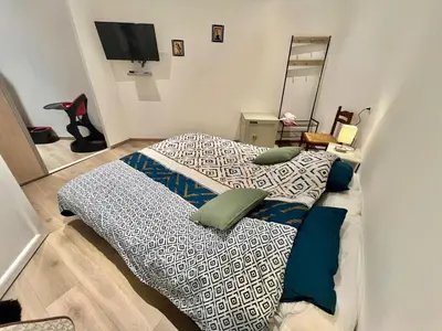 a bedroom with two beds with pillows on it at Woody old town appartement by Welcome to Cannes in Cannes