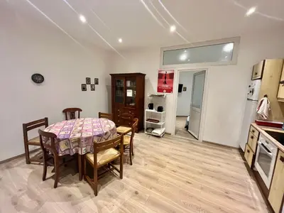 a kitchen and dining room with a table and chairs at Woody old town appartement by Welcome to Cannes in Cannes