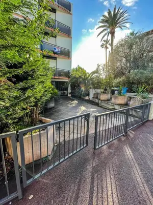 a metal fence in front of a building at Cocon Riviera in Cannes