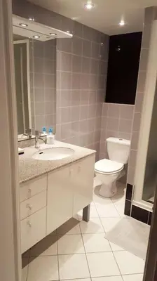 a bathroom with a sink and a toilet at Casa Charlotte nel cuore di Cannes in Cannes
