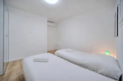 a white room with two beds in it at Charmant 2 chambres, MEYNADIER- FORVILE A2B243 in Cannes