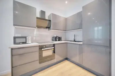 a kitchen with stainless steel cabinets and a microwave at Charmant 2 chambres, MEYNADIER- FORVILE A2B243 in Cannes