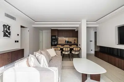 a living room with a couch and a table at Luxurious Apartment- Croisette-Carré d'Or in Cannes