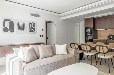 a living room with a couch and a table at Luxurious Apartment- Croisette-Carré d'Or in Cannes