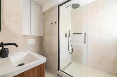a bathroom with a sink and a shower at Luxurious Apartment- Croisette-Carré d'Or in Cannes