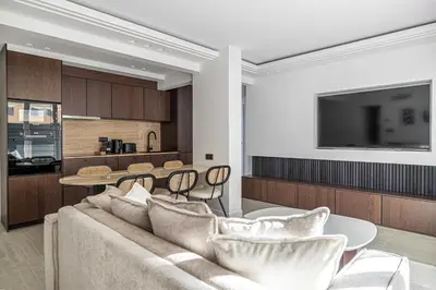a living room with a couch and a table at Luxurious Apartment- Croisette-Carré d'Or in Cannes