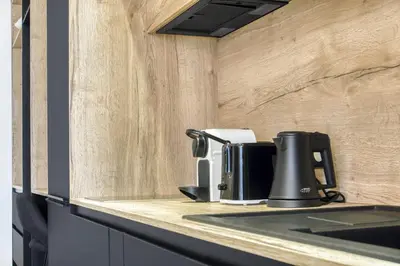 a coffee maker sitting on a counter in a kitchen at 1 Chambre Modern D - Calme - Hypercentre à 2 minutes du palais in Cannes