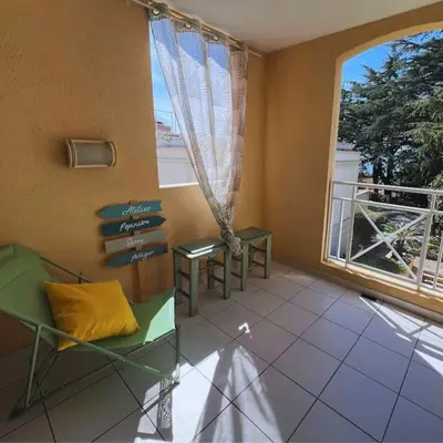a room with a window and a bench and a table at Villa Francia Cannes in Cannes