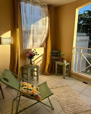 a living room with a chair and a window at Villa Francia Cannes in Cannes