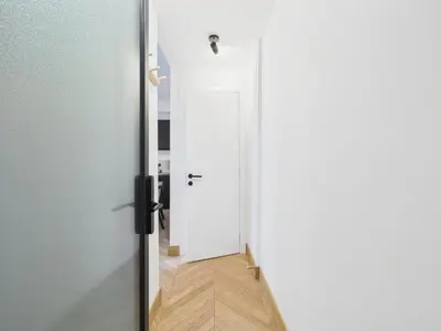 a door that is open to a hallway at Appartement centre cannes croisette / palais festival in Cannes