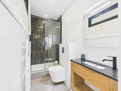 a bathroom with a toilet and a sink and a shower at Appartement centre cannes croisette / palais festival in Cannes