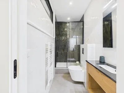 a bathroom with a toilet and a sink and a shower at Appartement centre cannes croisette / palais festival in Cannes