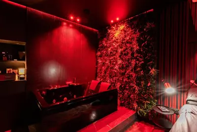 a red room with a red wall with a red light at Évasion intime : Love Room de luxe à Cannes in Cannes