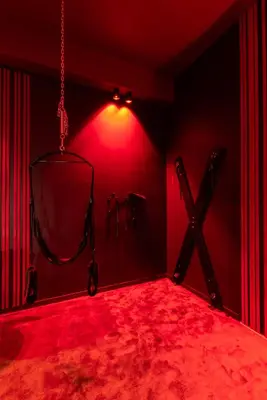 a dark room with a red room with a red light at Évasion intime : Love Room de luxe à Cannes in Cannes
