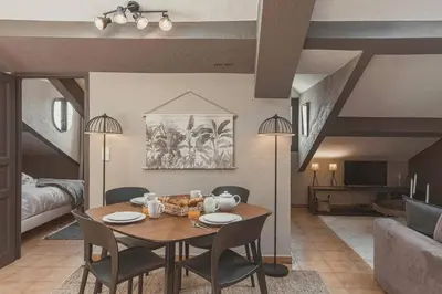 a living room with a table and chairs and a couch at 
