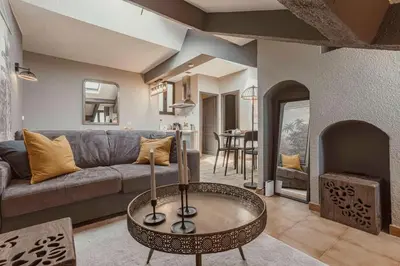 a living room with a couch and a table at 
