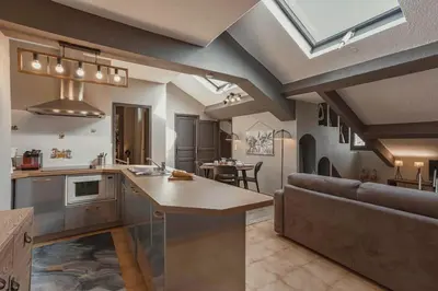 an open kitchen and living room with a couch at 