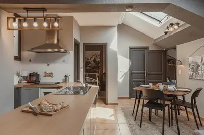 a kitchen with a table and a dining room at 