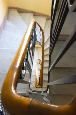 a set of stairs with a stair case in a building at Cannes Croisette - 4 Personnes - Vue mer in Cannes