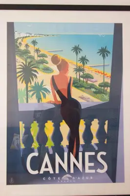 a poster of a woman standing on a beach at Cannes Croisette - 4 Personnes - Vue mer in Cannes