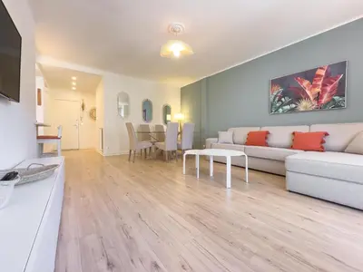 a living room with a couch and a table at Le Palm by Winsome Destination in Cannes