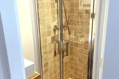 a shower with a glass door in a bathroom at Augusta Palace - T3 **** 74m² - 150m Croisette in Cannes