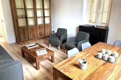 a living room with a coffee table and chairs at Augusta Palace - T3 **** 74m² - 150m Croisette in Cannes