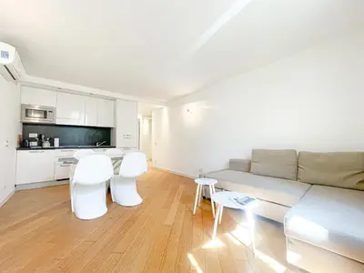 a living room with a couch and a table and chairs at Tony Allard By Winsome Destination 3E in Cannes